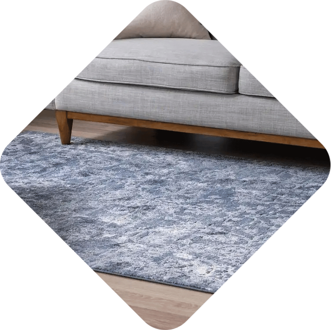 Tätigkeitsbereich Teppich / Carpets, Teppich unter einem Sofa im Wohnbereich